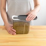 Clear 4 liter cereal storage container with airtight seal and pull-back lid, ideal for keeping cereal fresh and organized