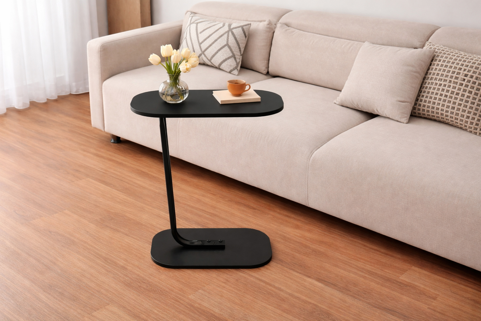 Modern C shape sofa side table with wood top and metal frame used beside a sofa in a living room