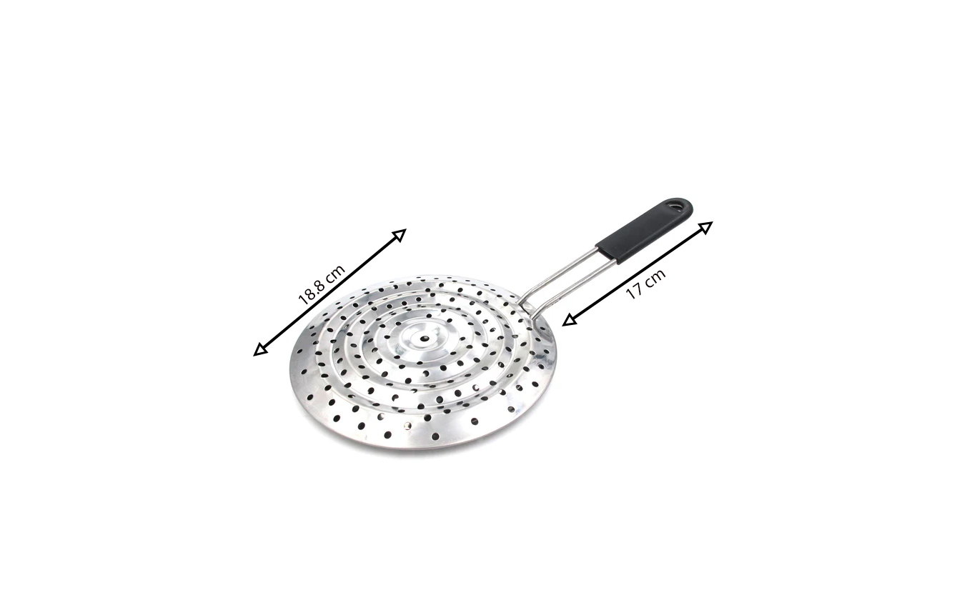 Stovetop simmer ring heat diffuser made of metal with plastic handle placed on gas stove to prevent burning and scorching food