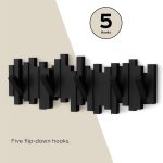 Piano style wall-mounted coat rack with 5 retractable flip hooks made of wood in black color for space saving organization