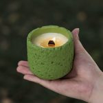 Candle cup incense burner with cement pot and scented wax candle used as table decoration for home and aromatherapy purposes