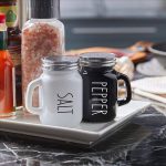 2-piece mug shaped salt and pepper shaker set made of glass with handle in black and white for modern kitchen and dining table