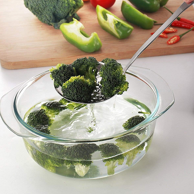 Stainless steel skimmer slotted spoon with ergonomic handle and hanging hole for frying and draining oil – Shop now from Homedash in Lebanon.