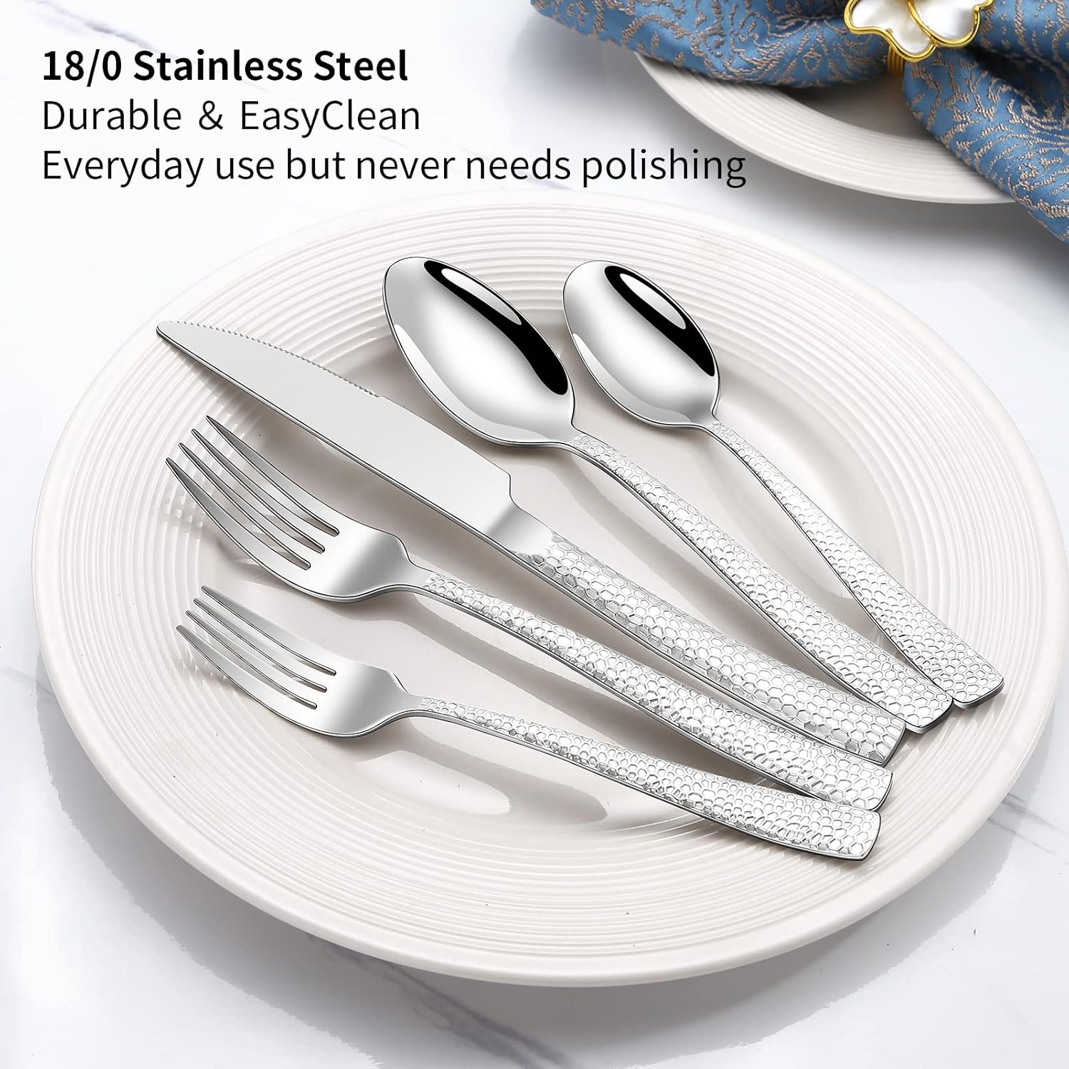 stainless steel 30-piece cutlery set with mirror finish including forks, spoons and knives arranged around dining plate
