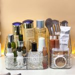 multifunction bathroom organizer box for cosmetics and makeup tools placed on a bedroom vanity counter