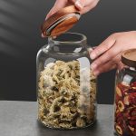round glass storage jar with acacia wood lid and airtight silicone seal, transparent stackable kitchen container – shop now from Homedash in Lebanon.