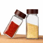 Set of 12 clear glass spice jars with wooden lids for kitchen storage and organization