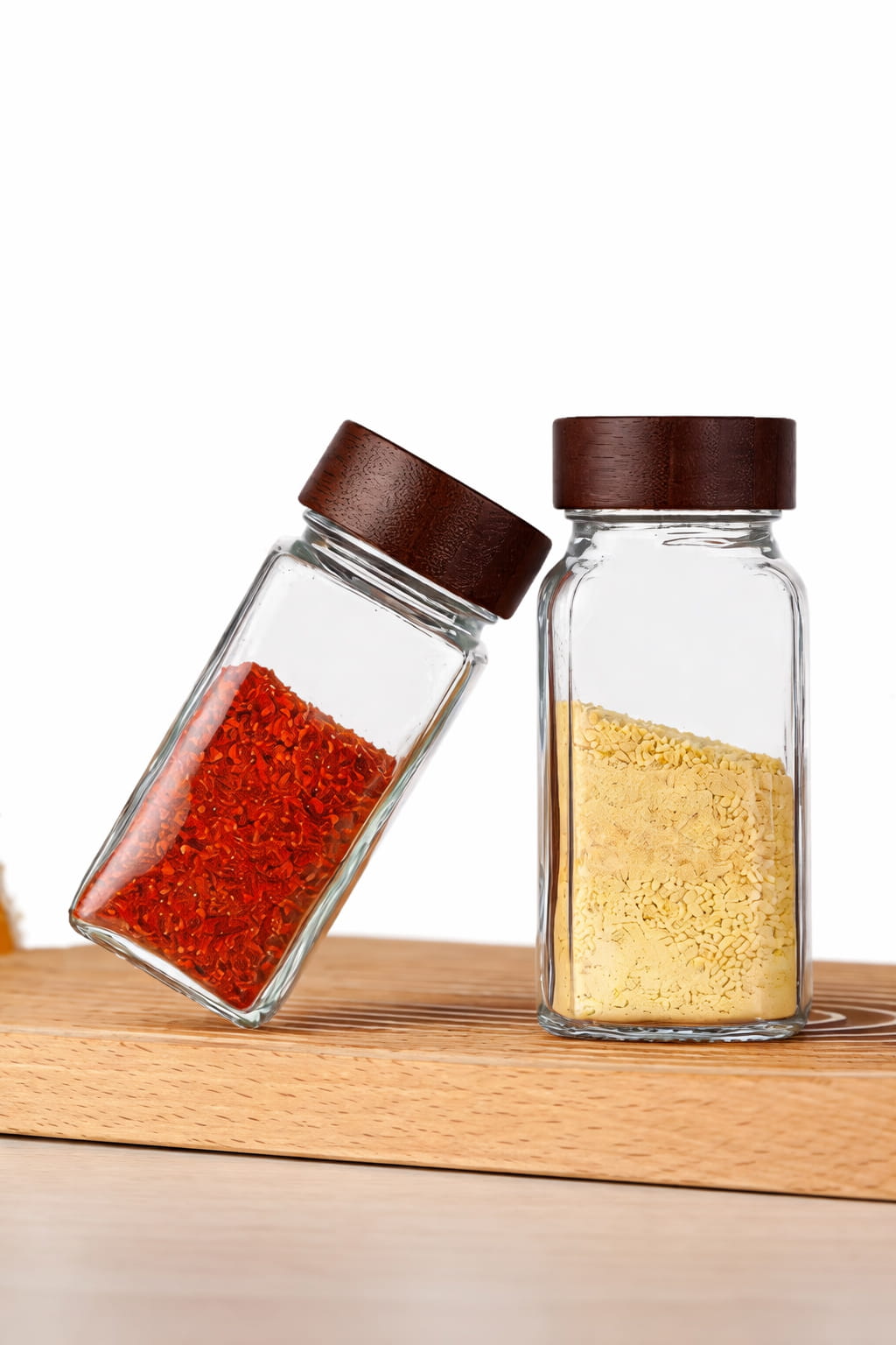 Set of 12 clear glass spice jars with wooden lids for kitchen storage and organization