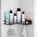 adhesive bathroom corner shelf organizer with hanging hooks storing bottles and accessories