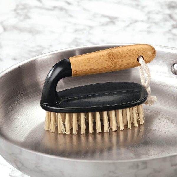 scrubber brush cleaning kitchen sink and cookware with strong bristles