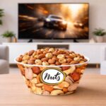 Popcorn snack bowl with chips on table in front of TV in modern living room setting