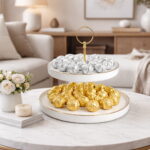 white porcelain dual-tier dessert stand with gold handle and rims for serving sweets and chocolates in Lebanon