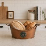 bread basket with handles on white background, gondola design serving bowl for bread and croissants