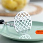 Stainless steel potato masher with non-slip plastic handle for smooth mashing