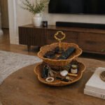 rattan basket stand for fruit and snacks with gold handle on display