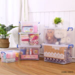 Transparent 50L plastic storage bin with lid, blue clip-lock handles, and wheels for home organization in Lebanon