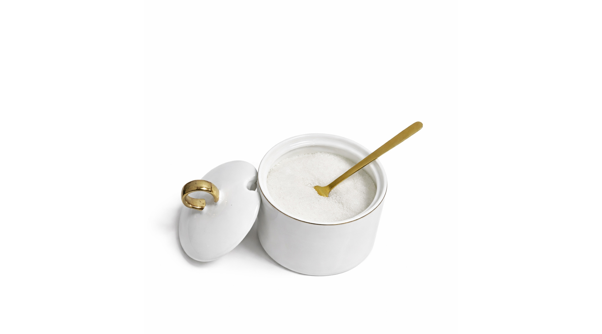 sugar bowl with lid and gold spoon on a clean white background, elegant modern design