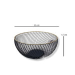 Wide black metal fruit basket with gold rim holding apples and bananas on white background