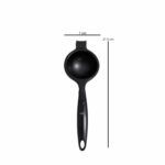 Barella handheld lemon squeezer CF 1212 B black manual citrus juicer on white background with fresh lemon halves