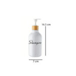 refillable bathroom dispenser bottles for shampoo, conditioner, and body wash with bamboo pump design in a modern bathroom setting