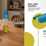 glass olive oil dispenser with smart flip lid and drip-free stainless-steel spout on white background
