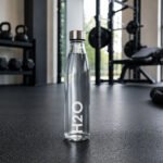 glass water bottle 1 liter with stainless steel leak-proof lid available in black gold and white lettering in Lebanon