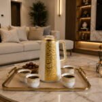 Luxury white and gold Arabic coffee thermos 1L with elegant gold calligraphy design and premium insulated serving flask for Arabic coffee and tea.
