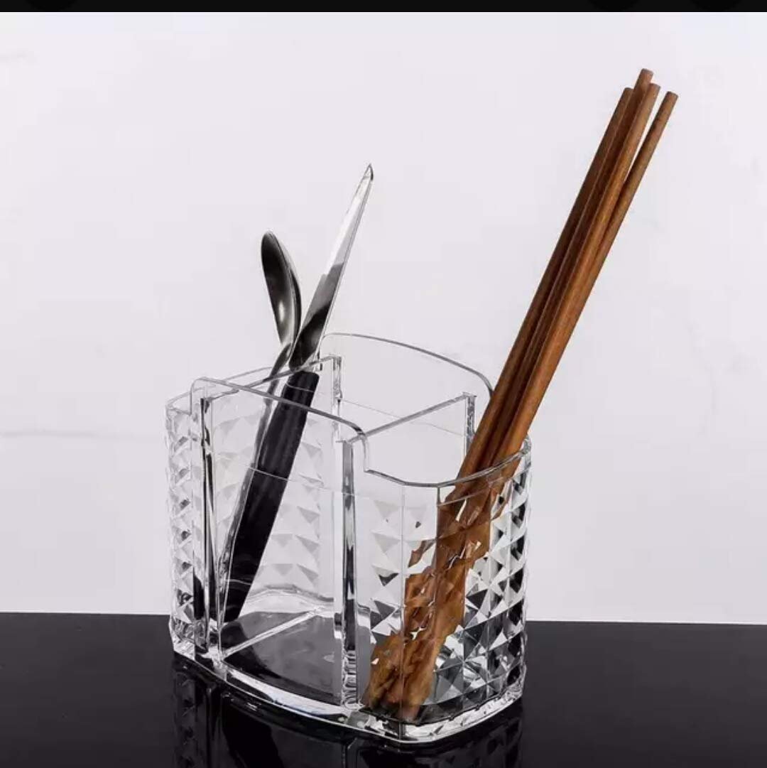 Transparent acrylic storage organizer with multiple compartments for kitchen utensils and makeup brushes on a white background