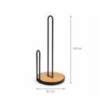 Freestanding black iron grid kitchen roll holder with natural bamboo base on white background.