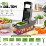 Multi-function vegetable slicer and chopper with drainer basket, interchangeable stainless-steel blades, peeler, grater, and food container.