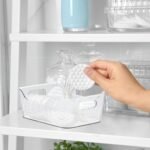 plastic storage basket with built-in handles for refrigerator, pantry, bathroom, and home organization.