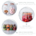 Round 3-liter glass storage jar with airtight silicone-sealed lid and metal clasp for kitchen pantry organization.