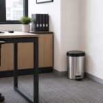 metallic-look pedal dustbin with removable inner bucket and handle for hygienic home and office waste disposal.