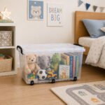Transparent 42-liter BPA-free plastic storage box with secure clip-lock lid, six wheels, and blue handles for easy home organization and storage.