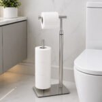 free-standing toilet paper holder with silver dispenser arm