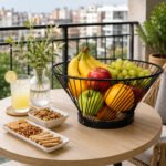 metal fruit storage basket with a natural wood base for organizing fruits, vegetables, bread, and household essentials.