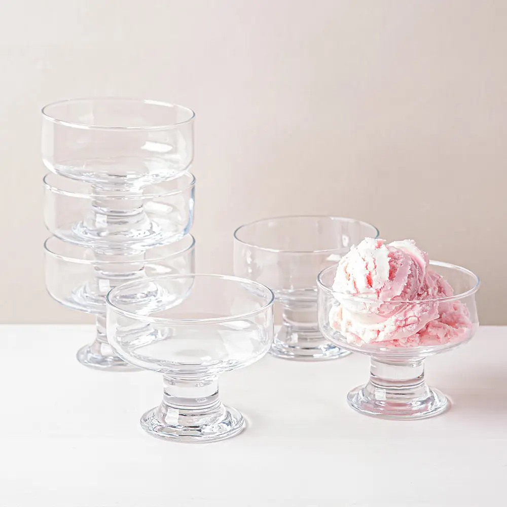 set of six 265ml clear footed glass dessert bowls, ideal for serving ice cream, puddings, fruit, salads, and snacks.