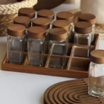 Set of 12 square glass spice jars with shaker inserts, wood lids and storage stand