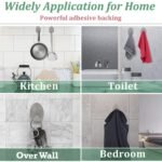 Set of four self-adhesive stainless steel wall hooks holding keys, towel, sponge, and bath loofah on a white background.