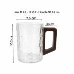 clear glass mug with geometric dark wooden handle