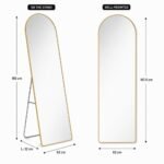 Full-length arched mirror with black metal frame and silver foldable stand